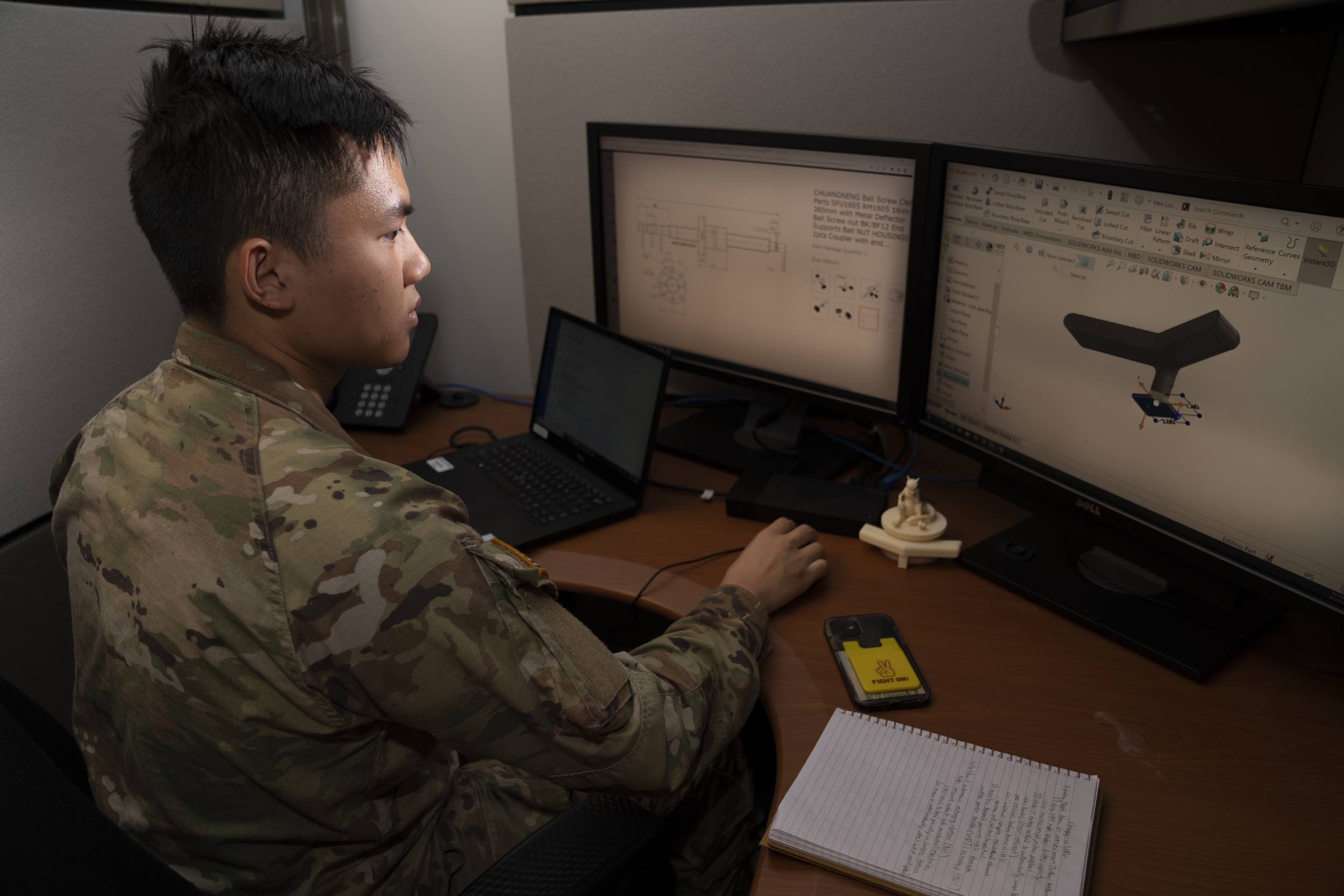 Viet Tran works at his desk.