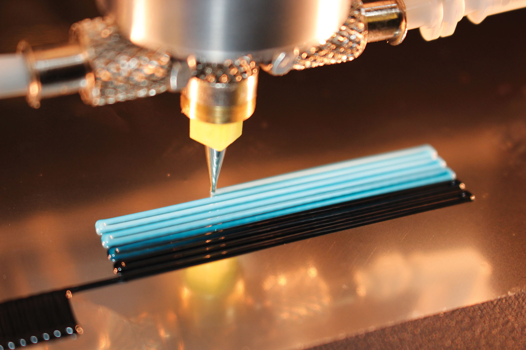 Photo of Lincoln Laboratory custom active mixing nozzle used in direct ink writing with tailored nanocomposite materials.