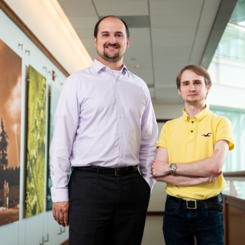 a photo of Charles Munson and Nabil Schear in a hallway 