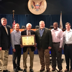 Five industry group representatives attended the 2019 Friends and Partners of Aviation Weather meeting to award James Evans (center) the third annual Aviation and Space Operations Weather Prize.