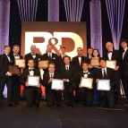 The principal researchers of MIT Lincoln Laboratory's 12 finalists for 2018 R&D 100 Awards are pictured here with Lincoln Laboratory Director Eric Evans (far left). The principal researchers of the 10 winning technologies hold up their award plaques. 